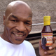 Image for article titled Mike Tyson: Evander Holyfield's Barbecue Sauce Is Ear-Licking Good